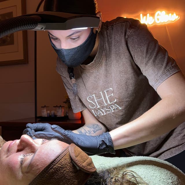 A facial treatment in progress at SHE Day Spa
